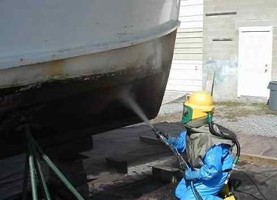 Sandblasting Houseboat Bottoms at 4 Corners Marine